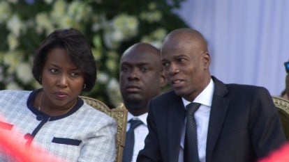 President of Haiti Jovenel Moise (C) and his wife attend a funeral service for the late former Haitian president Rene Preval.