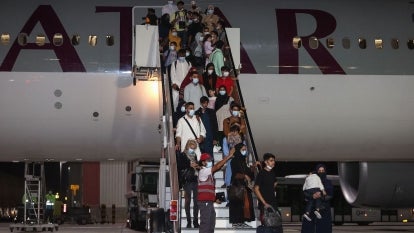 Evacuees from Afghanistan arrive at Hamad International Airport in Qatar's capital Doha on September 10, 2021. 