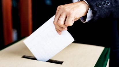 Two election workers were fired for allegedly destroying registration forms, officials said.
