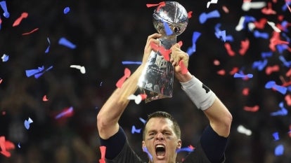 Tom Brady #12 of the New England Patriots holds the Vince Lombardi Trophy after defeating the Atlanta Falcons 34-28 in overtime during Super Bowl 51 at NRG Stadium on February 5, 2017 in Houston, Texas