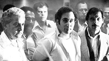 "Son of Sam," David Berkowitz, stands before Criminal Court Judge Richard Brown at the Criminal Court building in Brooklyn, N.Y. to hear charges accusing him in six random murders on August 11, 1977.
