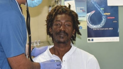Elvis Francois, 47, getting checked up by a doctor