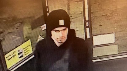 Jarid Haddock, a 21-yr-old, wearing black hat and black sweatshirt