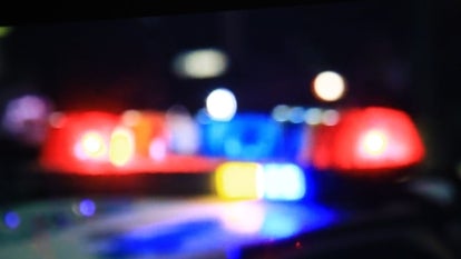 blurry police car siren lights of red and blue