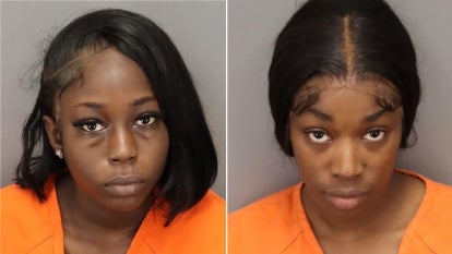 The two nursing home staff were arrested and charged after an incident involving two elderly residents.