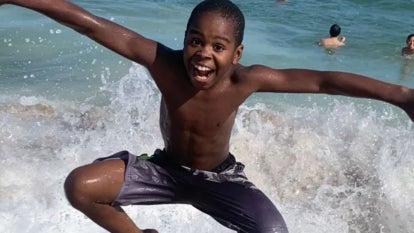 Elijah Jordan Brown Garcia, Black boy, jumping happily at beach