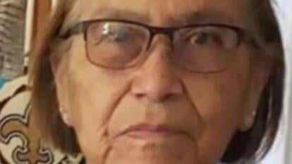 Ella Mae Begay, 62, Native American woman with brown hair wearing glasses