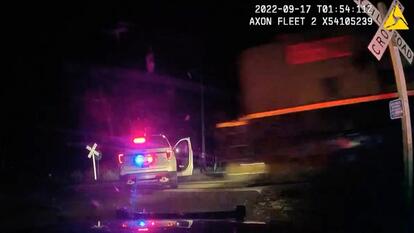 Police Cruiser on Train Tracks