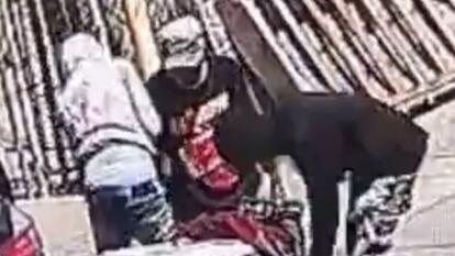 two men walking standing around ice cream man