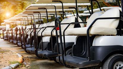 Golf cars in a row