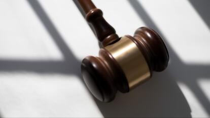 Judge’s traditional wooden gavel on white background & shadow detail