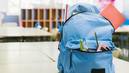 Blue school child backpack on table
