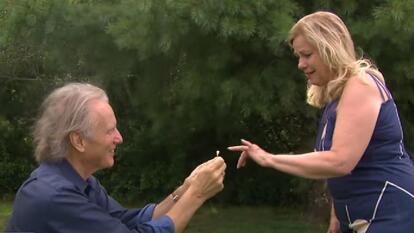 Ken Steinkamp on one knee proposing to Sandra Sikorski