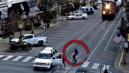 Witnesses Help Driver Push Car Off Railroad Tracks