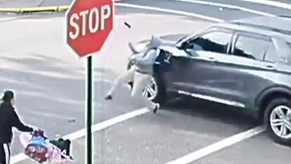 Surveillance camera footage of SUV striking child in crosswalk 