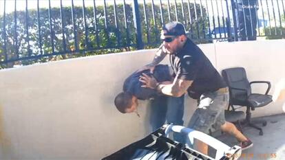 Good Samaritan holds suspect for police.