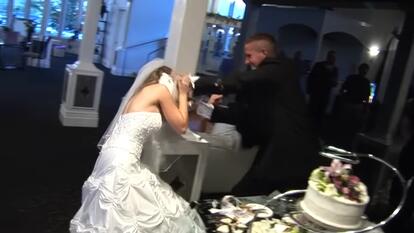 Groom smashes cake into bride's face at wedding