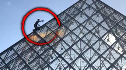 Activist pours paint on Pyramid at Louvre Museum.