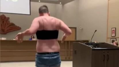 man in black top and short jean shorts