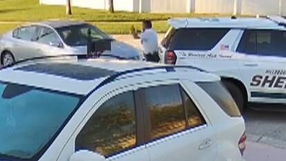 Car plows into sheriff's deputies and their vehicle.