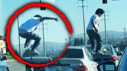 man on top of car in a red circle