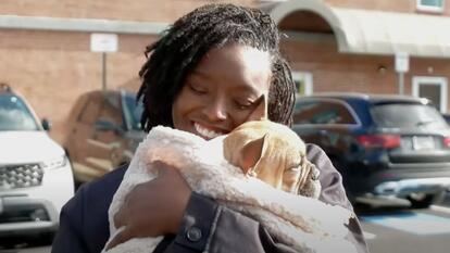 Woman holding her French Bulldog