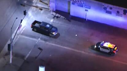 An allegedly stolen truck drove backwards as the LAPD pursued the suspect.