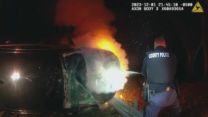 officer puts out car fire