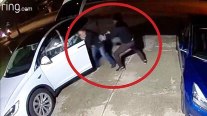 A white car in a driveway with a red circle around a victim trying to enter the driver-side door as a perpetrator is grabbing her.