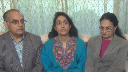 Vijay Wali, his wife Jyotika and their daughter sitting in between them