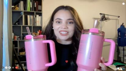 Woman with two pink Stanley cups