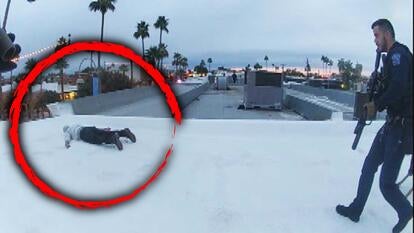 man on ground in a red circle