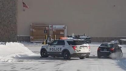 Skid Loader Rams Into Cop Car 