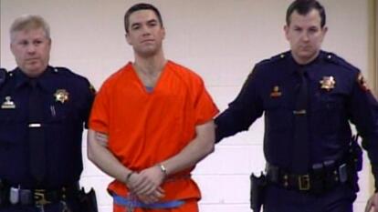 Scott Peterson in handcuffs.