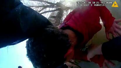  Boy being rescued from an ice pond.