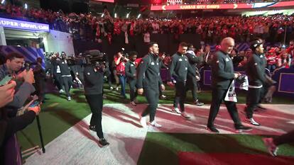 Players enter the stadium for Super Bowl media night
