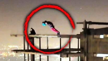 Person base jumping off an abandoned sky scraper 