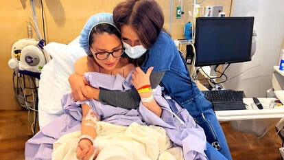 Olivia Munn in a hospital room