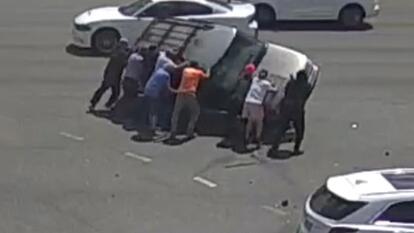 A group of motorists flipped an SUV that had turned on its side during a car accident in Daytona Beach, Florida.