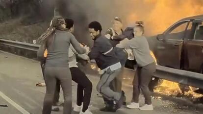 man pulled from burning car