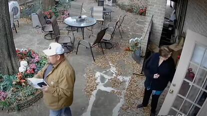 surveillance video snapshot of Loli McIlwain walking man to her backyard