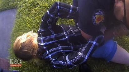 Taylor Rogers being arrested. 