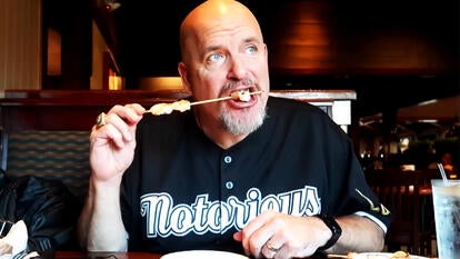 Man eats shrimp at Red Lobster