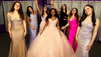 High schoolers in their prom dresses