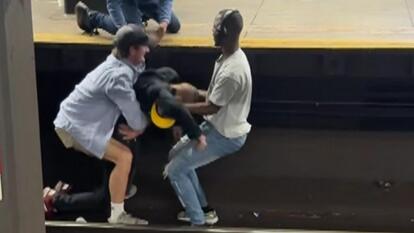 2 people save unconscious man. 