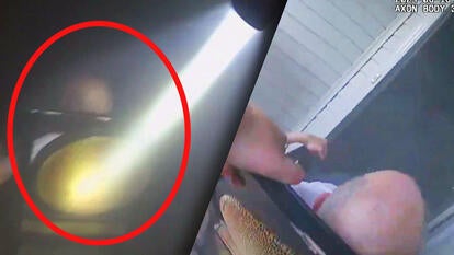 officer with flashlight / man in wheelchair