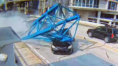 Crane falls on car
