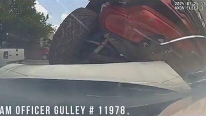 A stolen red truck rammed into a Texas police car.