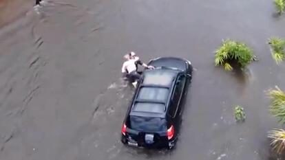 Woman Trapped in SUV Is Saved During Tropical Storm Debby