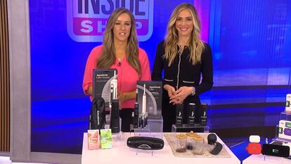 Megan Alexander and Knocking representative stand behind table with products